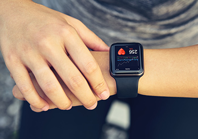 Woman checking her apple watch heart beat